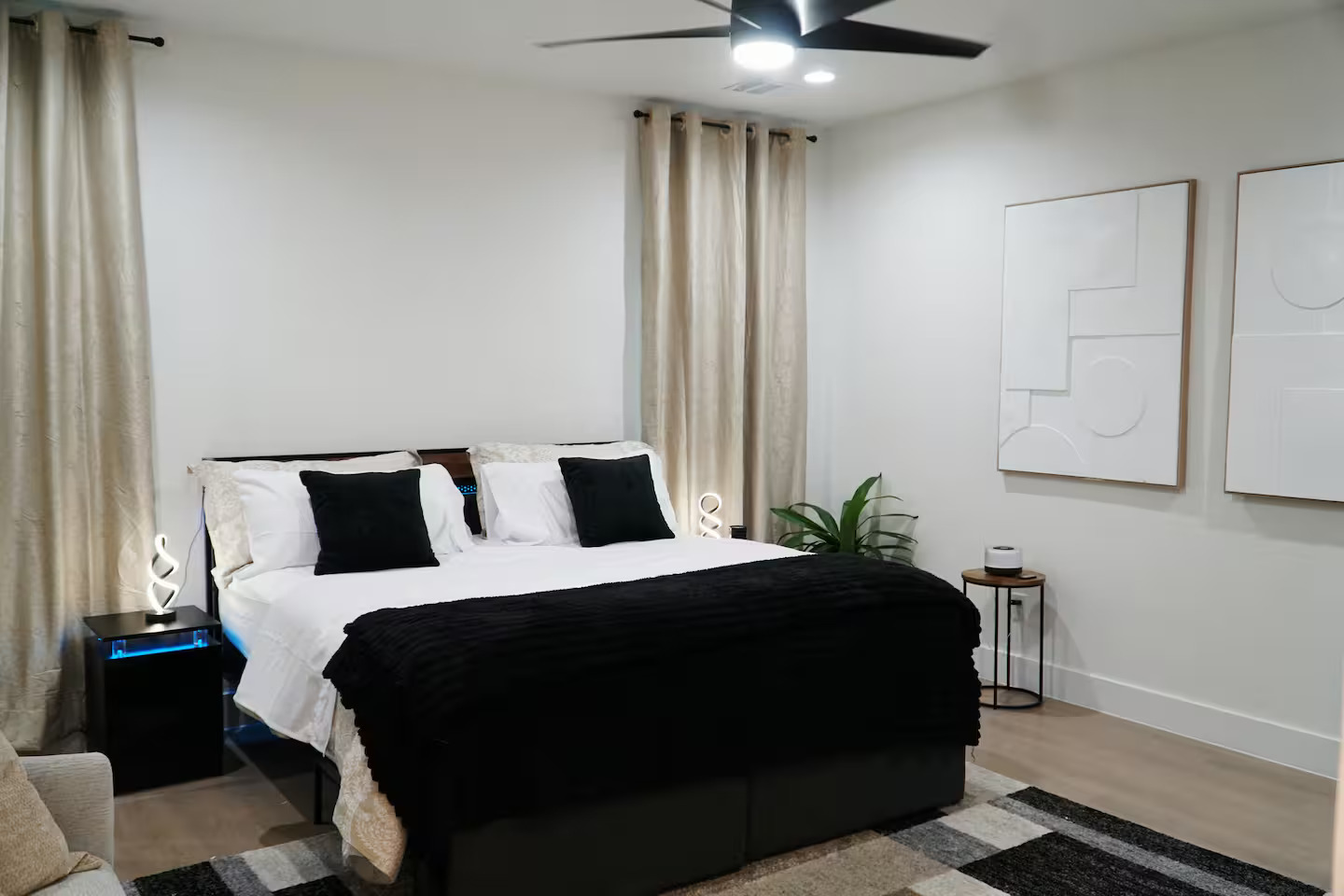 Primary king bedroom with abstract wall art