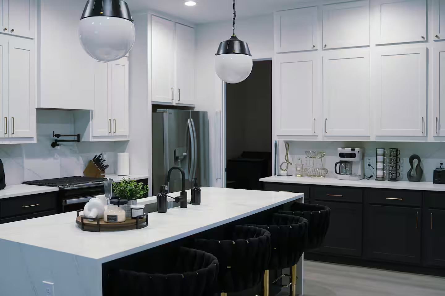 Wide kitchen with marble waterfall island